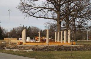 Heavy roof beams have been moved in, waiting for placement