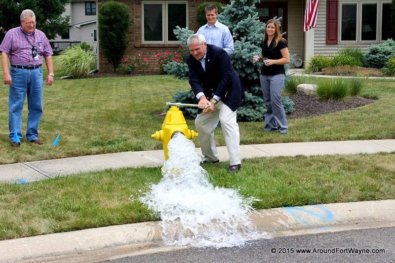 Mayor Henry starts the City water flowing Turning on the water in Aboite