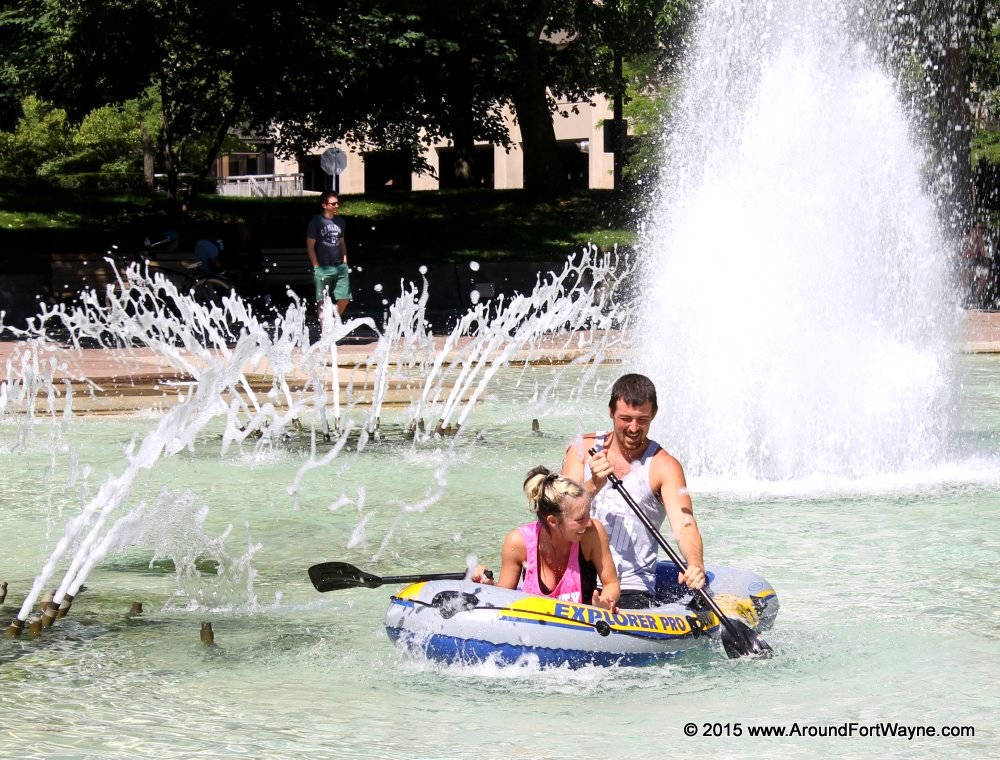 Paddling around in a downtown fountain Fort Wayne Adventure Games in Freimann Square