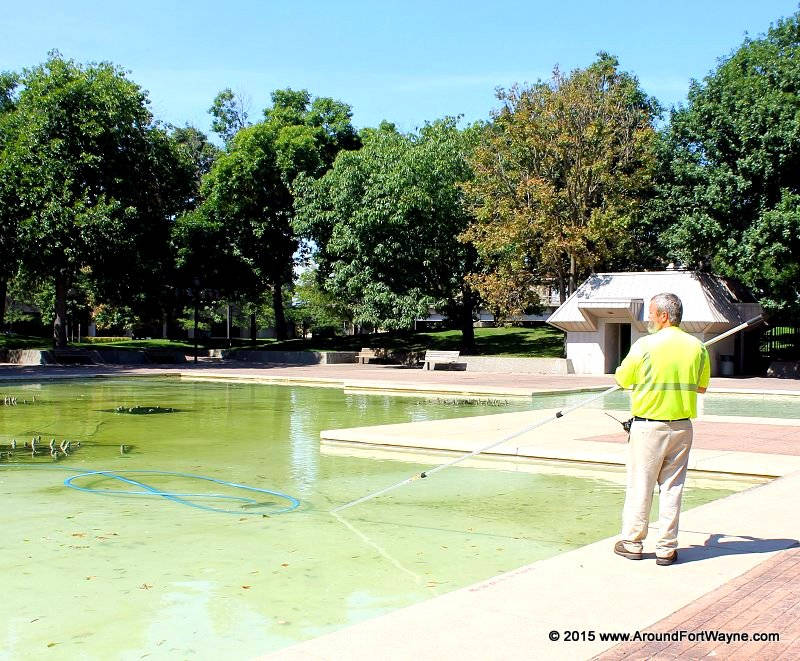 Cleaning the Freimann Square fountain A Parks employee cleans the Freimann Square Fountain
