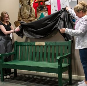 Family and friends of the late Mayor Tom Henry and City of Fort Wayne employees today at the unveiling and dedication of a new Buddy Bench inside the lobby of Citizens Square in honor of Mayor Henry. Photo courtesy of the City of Fort Wayne.
